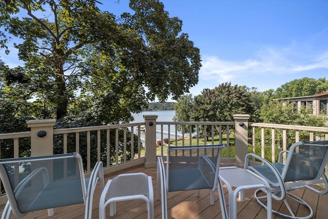 wooden deck featuring a water view