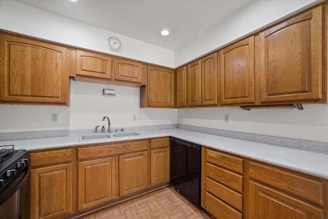 kitchen with brown cabinets, black appliances, a sink, recessed lighting, and light countertops