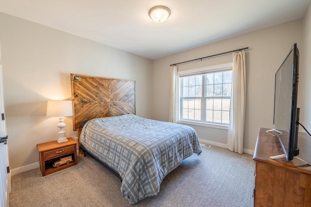 carpeted bedroom with baseboards