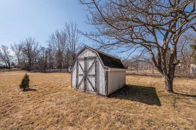 view of shed featuring fence