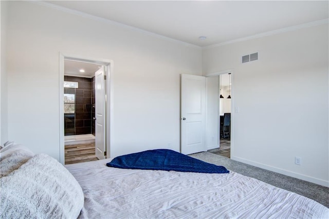 bedroom with baseboards, visible vents, carpet floors, and ornamental molding