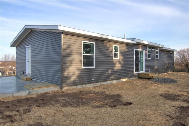 back of property with a patio area