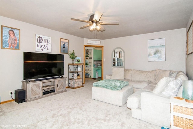 living room with carpet floors and ceiling fan