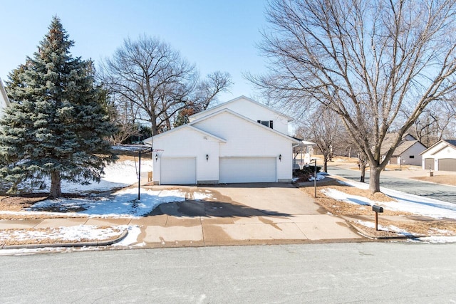 view of front of home featuring an attached garage and concrete driveway