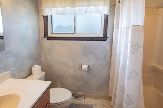 full bathroom with vanity, toilet, visible vents, and plenty of natural light