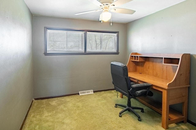 office space featuring visible vents, a healthy amount of sunlight, baseboards, and carpet floors