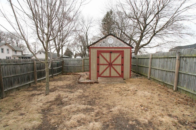 view of shed featuring a fenced backyard