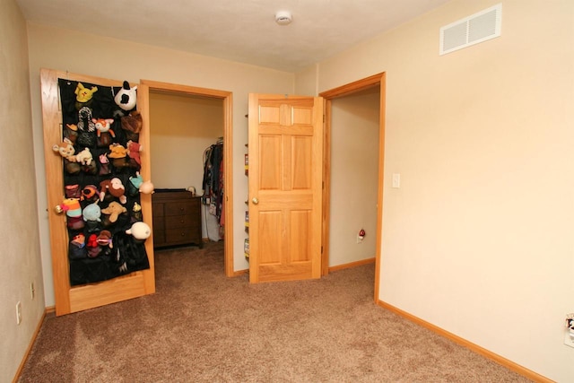 interior space with baseboards and visible vents