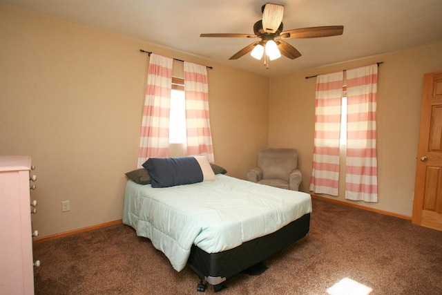 carpeted bedroom featuring baseboards and ceiling fan