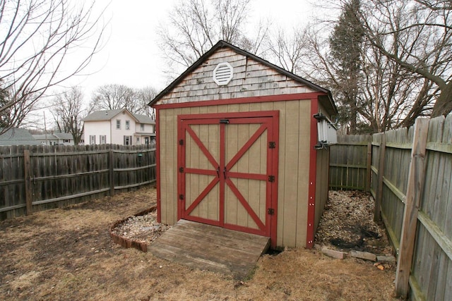 view of shed with a fenced backyard