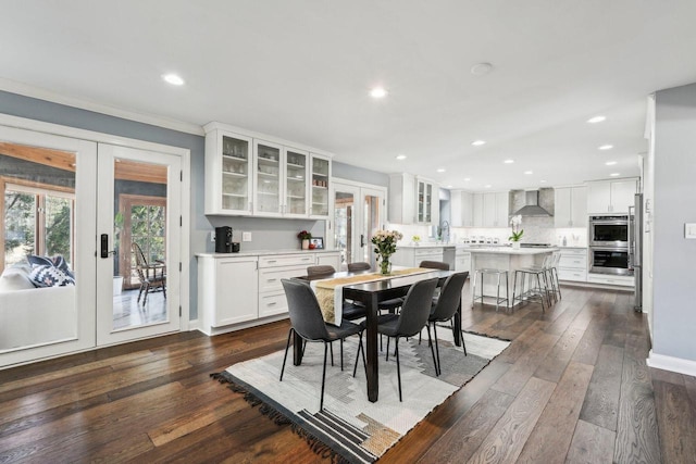 dining room with baseboards, ornamental molding, recessed lighting, french doors, and dark wood-style flooring