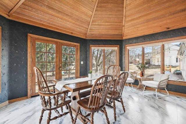 dining space with french doors, baseboards, wooden ceiling, and vaulted ceiling