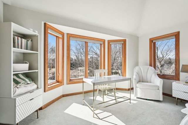 office space featuring carpet flooring, baseboards, and vaulted ceiling