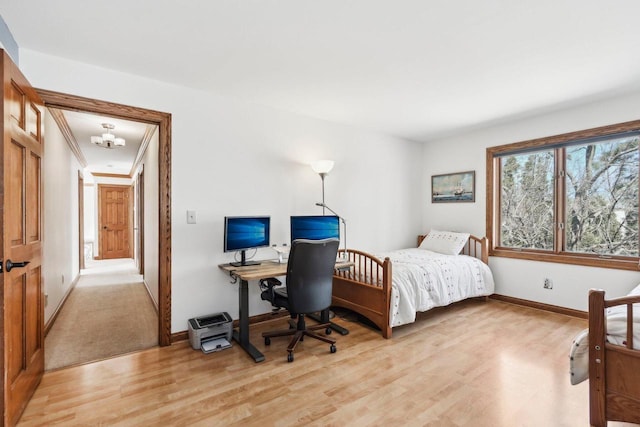 bedroom featuring baseboards and light wood-type flooring