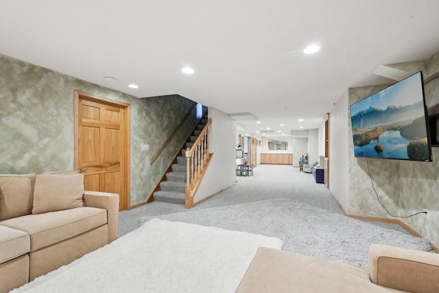 carpeted living area with recessed lighting, stairs, and baseboards