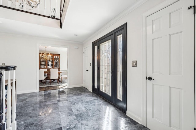 entryway with a notable chandelier, french doors, marble finish floor, and a healthy amount of sunlight