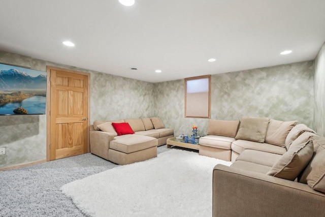 carpeted living area with recessed lighting