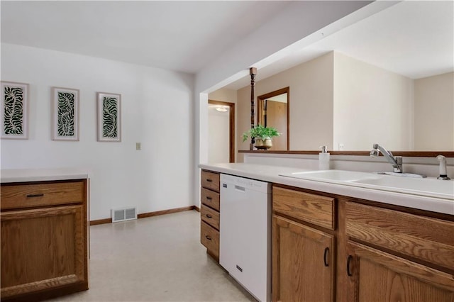 kitchen featuring visible vents, brown cabinets, a sink, light countertops, and dishwasher