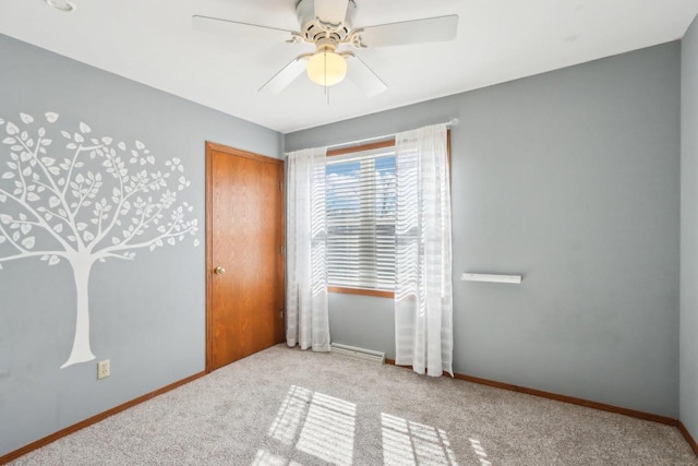 unfurnished bedroom with baseboards, carpet floors, a closet, and a ceiling fan