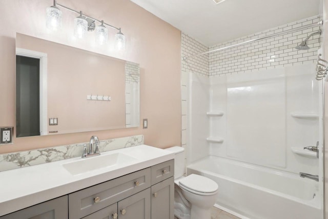 full bath with toilet, vanity, and shower / tub combination