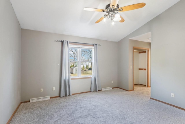 unfurnished room featuring visible vents, light colored carpet, baseboards, and vaulted ceiling