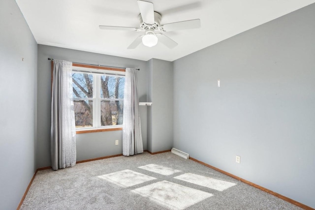 carpeted empty room with baseboards and ceiling fan