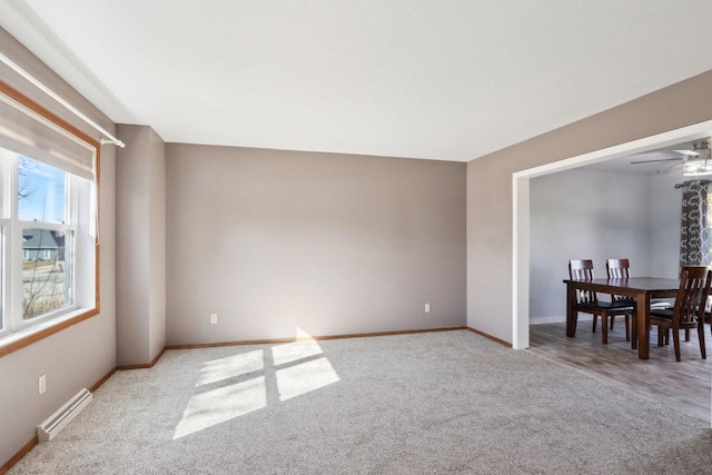 interior space featuring visible vents, ceiling fan, and baseboards