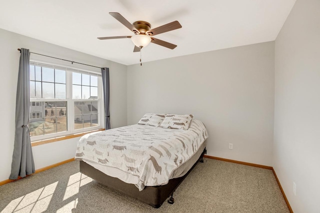 bedroom with baseboards, ceiling fan, and carpet flooring