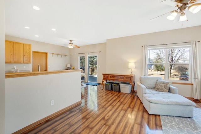 living room with recessed lighting, a ceiling fan, and wood finished floors