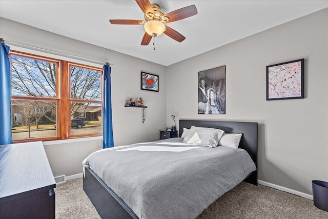 bedroom featuring baseboards, carpet floors, and ceiling fan