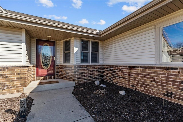 entrance to property with brick siding