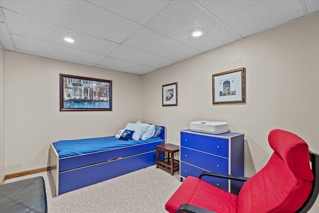 carpeted bedroom featuring recessed lighting, baseboards, and a paneled ceiling