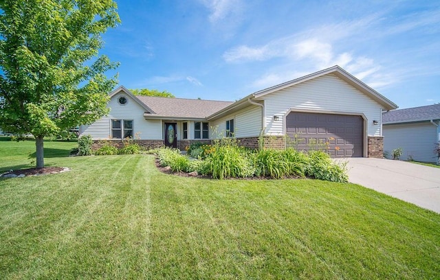 single story home with a garage, brick siding, concrete driveway, and a front lawn