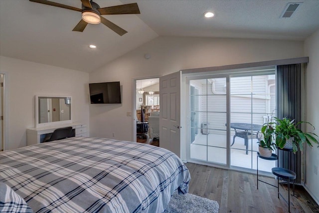 bedroom featuring visible vents, access to outside, wood finished floors, lofted ceiling, and ceiling fan