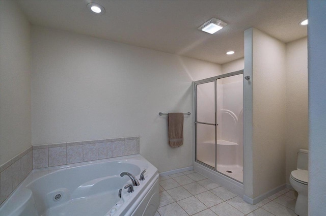 full bath with a tub with jets, baseboards, tile patterned flooring, a shower stall, and toilet