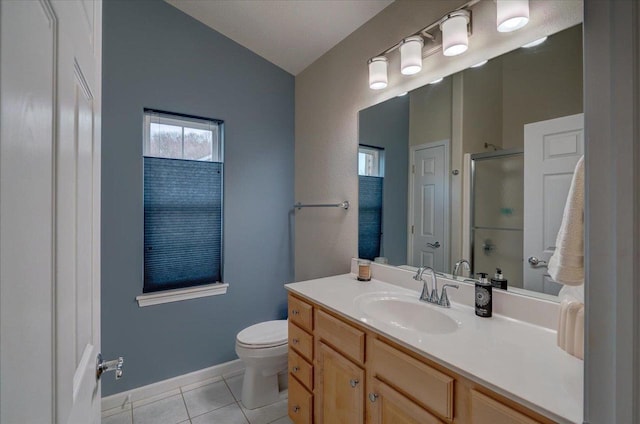 full bathroom with tile patterned flooring, baseboards, toilet, a shower with shower door, and vanity