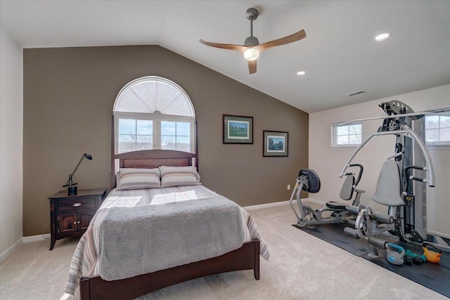 bedroom featuring light carpet, visible vents, baseboards, and lofted ceiling