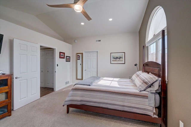 bedroom featuring lofted ceiling, carpet flooring, a ceiling fan, and visible vents