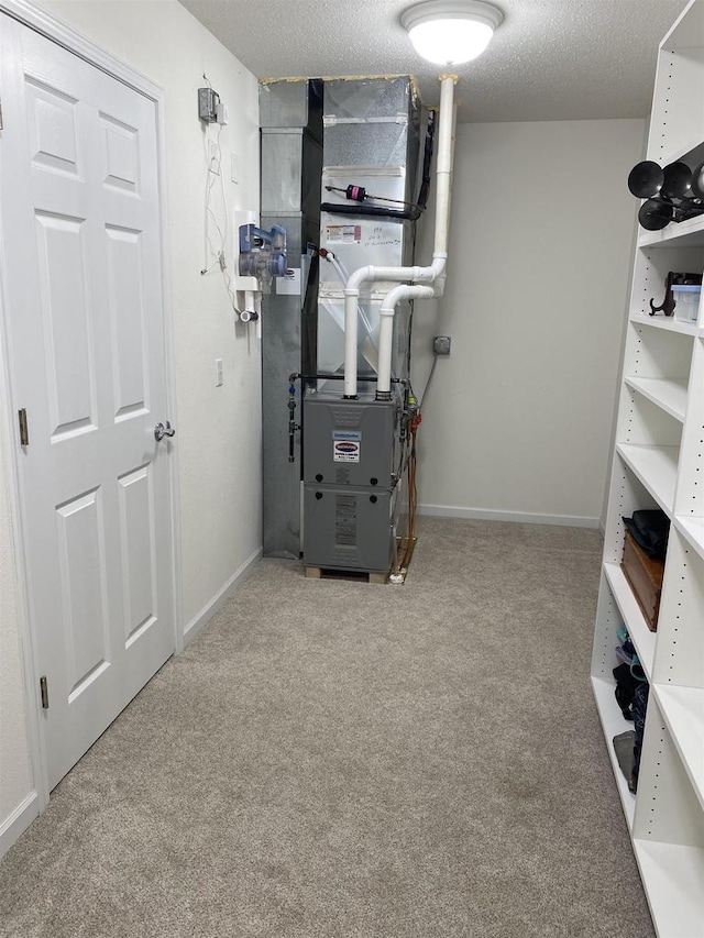 utility room featuring heating unit