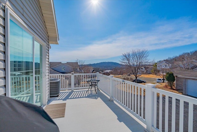 balcony with a mountain view and central AC