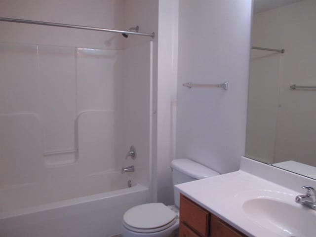 full bathroom with vanity,  shower combination, and toilet