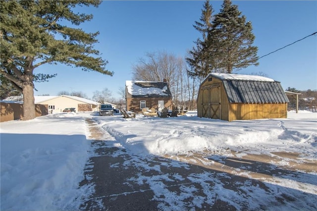 exterior space with a storage unit and an outbuilding