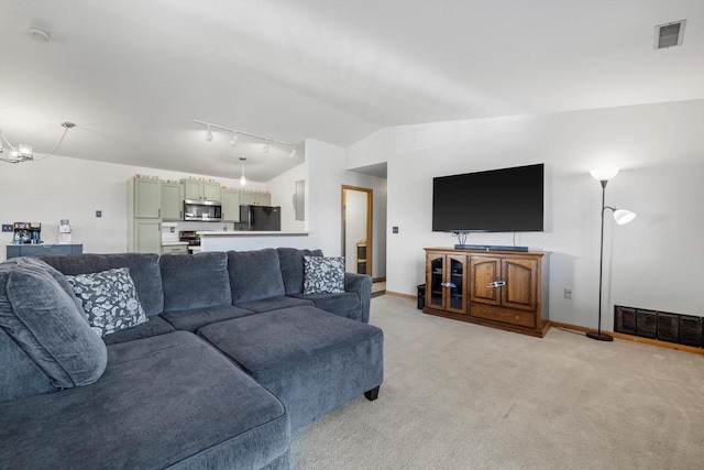 living area featuring vaulted ceiling, visible vents, a chandelier, and light carpet