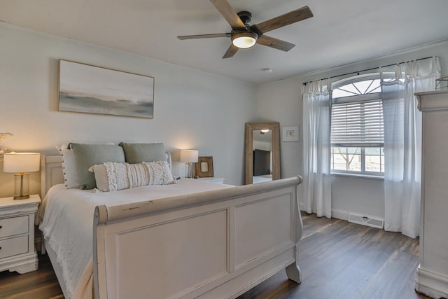 bedroom featuring dark wood-type flooring and ceiling fan