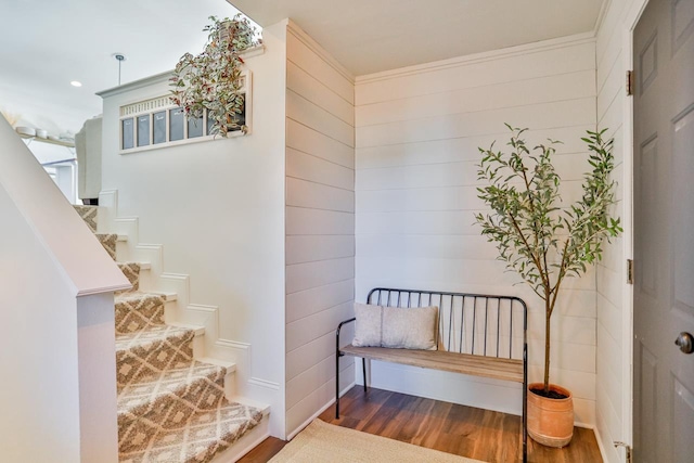 staircase featuring recessed lighting and wood finished floors