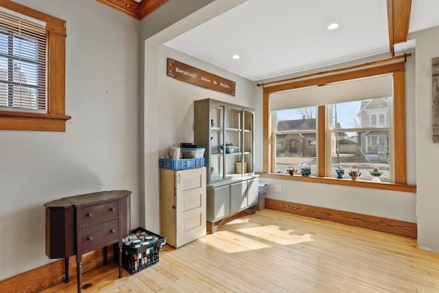 interior space with baseboards and hardwood / wood-style floors