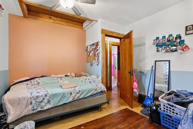 bedroom with ceiling fan and wood finished floors