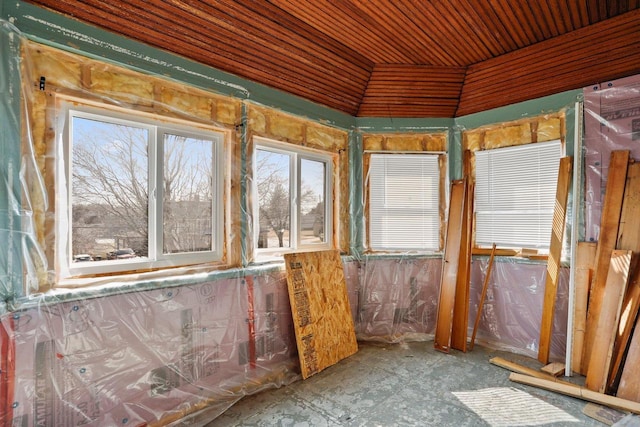 unfurnished sunroom featuring lofted ceiling