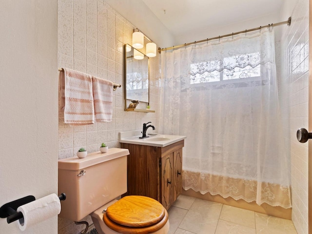 full bath featuring vanity, shower / tub combo, tile walls, toilet, and tile patterned floors