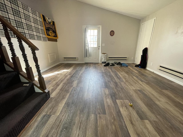 unfurnished living room with a baseboard heating unit, baseboards, stairs, lofted ceiling, and wood finished floors